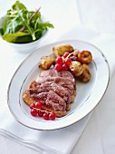 Duck breast with redcurrants and roast potatoes
