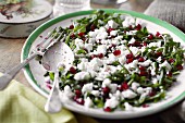 Rocket salad with pomegranate seeds and feta