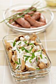 Mushrooms with chive sauce and mini sausages