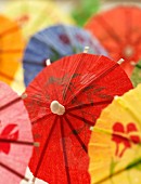 Several colourful cocktail umbrellas (close-up)