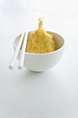 Tempura prawn in a bowl with chopsticks (Japan)