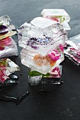 Ice cubes containing a variety of edible flowers
