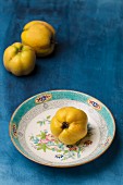 Quinces on a plate and to one side