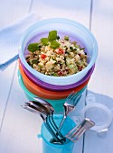 Couscous salad in a Tupperware container