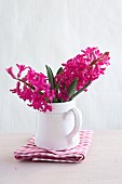 Deep pink hyacinths in china jug