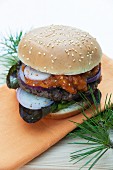 Venison burger in a bun with apricot chutney