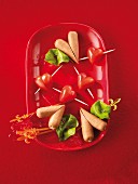 Sausages hearts with tomato arrows