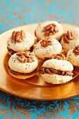 Walnut meringues with chocolate filling, for Christmas