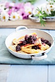 Baked bananas with blackberry sauce