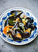 Mussels in a white wine sauce with carrots and leek