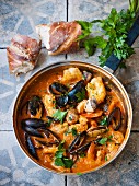 Pan-fried fish dish with mussels, tomatoes and prawns (Spain)