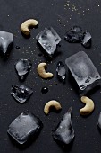 Several cashew nuts and ice cubes