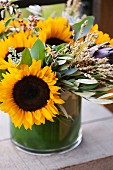 A Floral Arrangement with Sunflowers and Eucalyptus