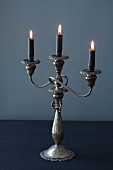 A Candelabra with Three Dark Candles Lit