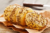 A roll of handmade Harzer (sour milk cheese) with caraway seeds