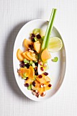 Persimmon salad with cranberries and celery