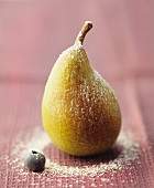 A pear dusted with icing sugar