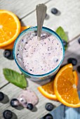 Blueberry yoghurt and slices of orange