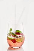 Raspberry cocktail with limes and mint