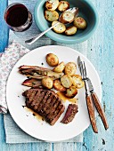 Grilled beef steak with endive and potatoes