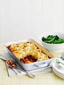 Shepherd's pie with soy sauce, peas and broccoli