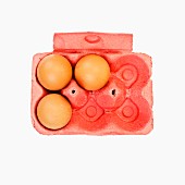 Three eggs in an egg box