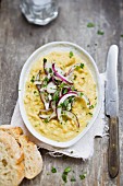 Yellow lentil puree with red onions