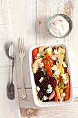 Oven-roasted vegetables with feta and olive oil (view from above)