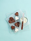 Heart-shaped chocolate tartlets with cream cheese frosting