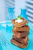 Triangular courgette waffles with yoghurt and mint leaves