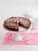 An Easter-themed chocolate cake on a cake stand