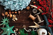 Various Christmas decorations (nuts, antlers, twigs of berries, stars)