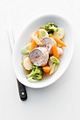 Poached pork fillet with leek, carrots and broccoli