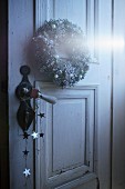 Christmas wreath on vintage interior door