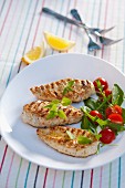 Grilled chicken breast with herbs and tomatoes