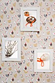Framed Easter pictures on wallpaper with pattern of hens