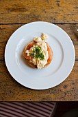 Bagel with salmon, scrambled egg and chives