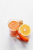 A smoothie with orange juice, carrots and ginger