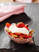 Strawberries with lime marinade, pecan nuts and cream