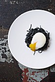Squid ink pasta with slow poached egg
