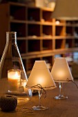 Atmospheric candle lanterns hand-crafted from wine glasses and wax paper shades