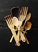 Assorted wooden spoons, frying spatulas and salad servers