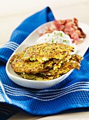 Courgette and carrot pancakes with quark and bacon