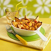 Potato wedges with sweetcorn, topped with cheese and grilled