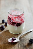 Yoghurt with blackberry compote; partly eaten
