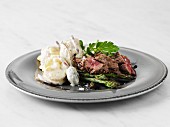 Beef with asparagus and warm potato salad