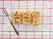 Peanut brittle on a glass plate