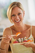 A woman eating sushi