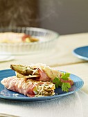 Endive wrapped in bacon, topped with cheese and grilled