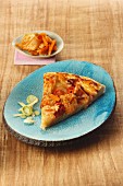 Pizza topped with kimchi, carrots and spring onions